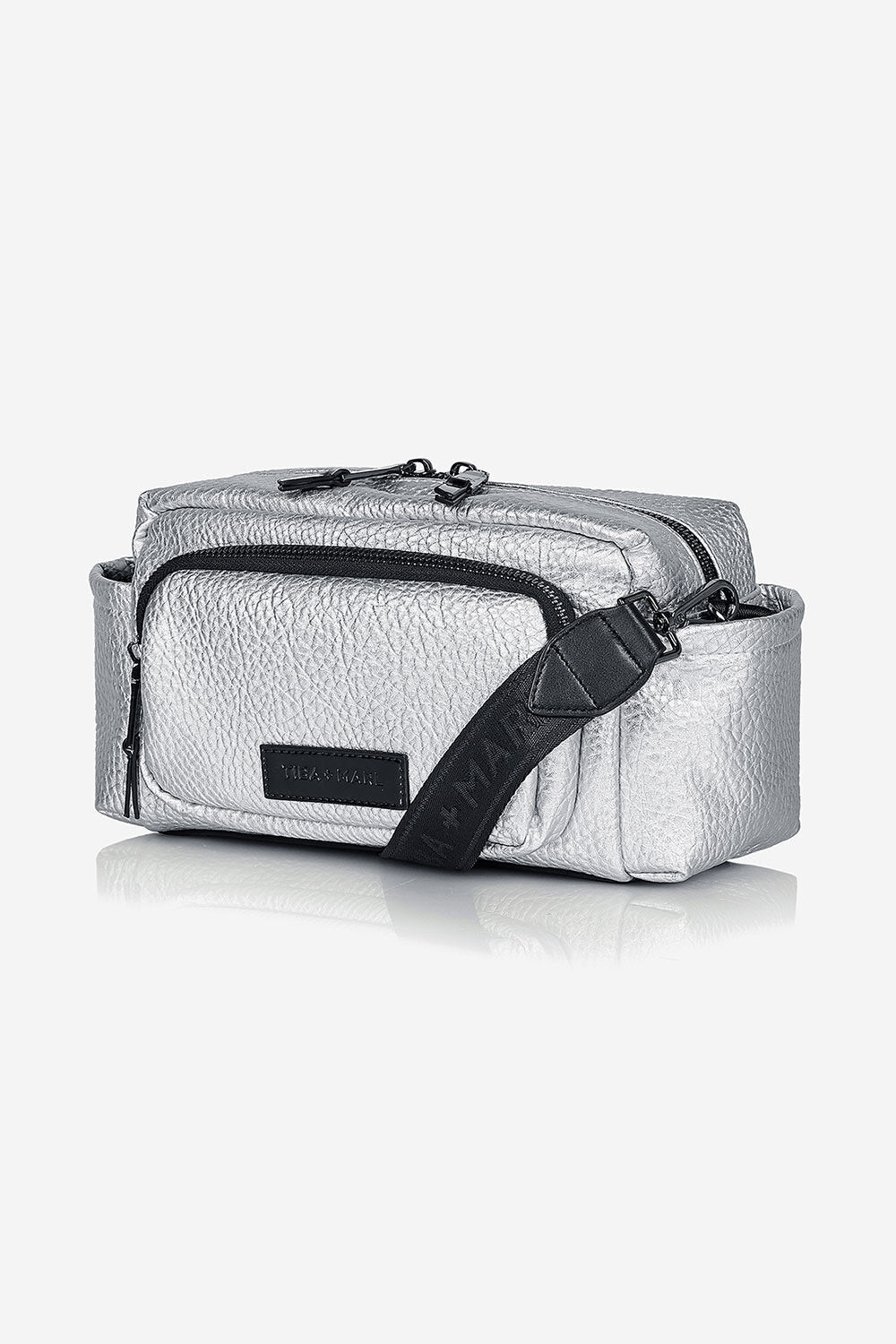 Silver textured crossbody bag with black strap on a white background