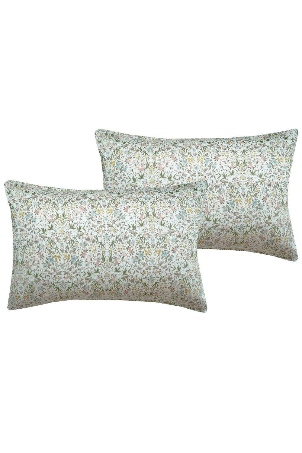 Two floral-patterned pillows on a solid background