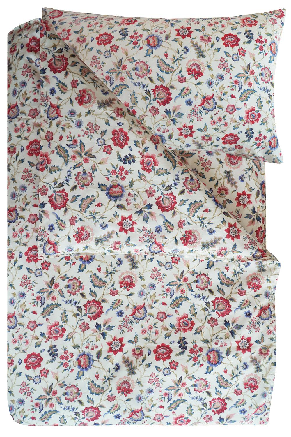 Floral patterned bedding set with red, pink, and blue flowers on a white background.