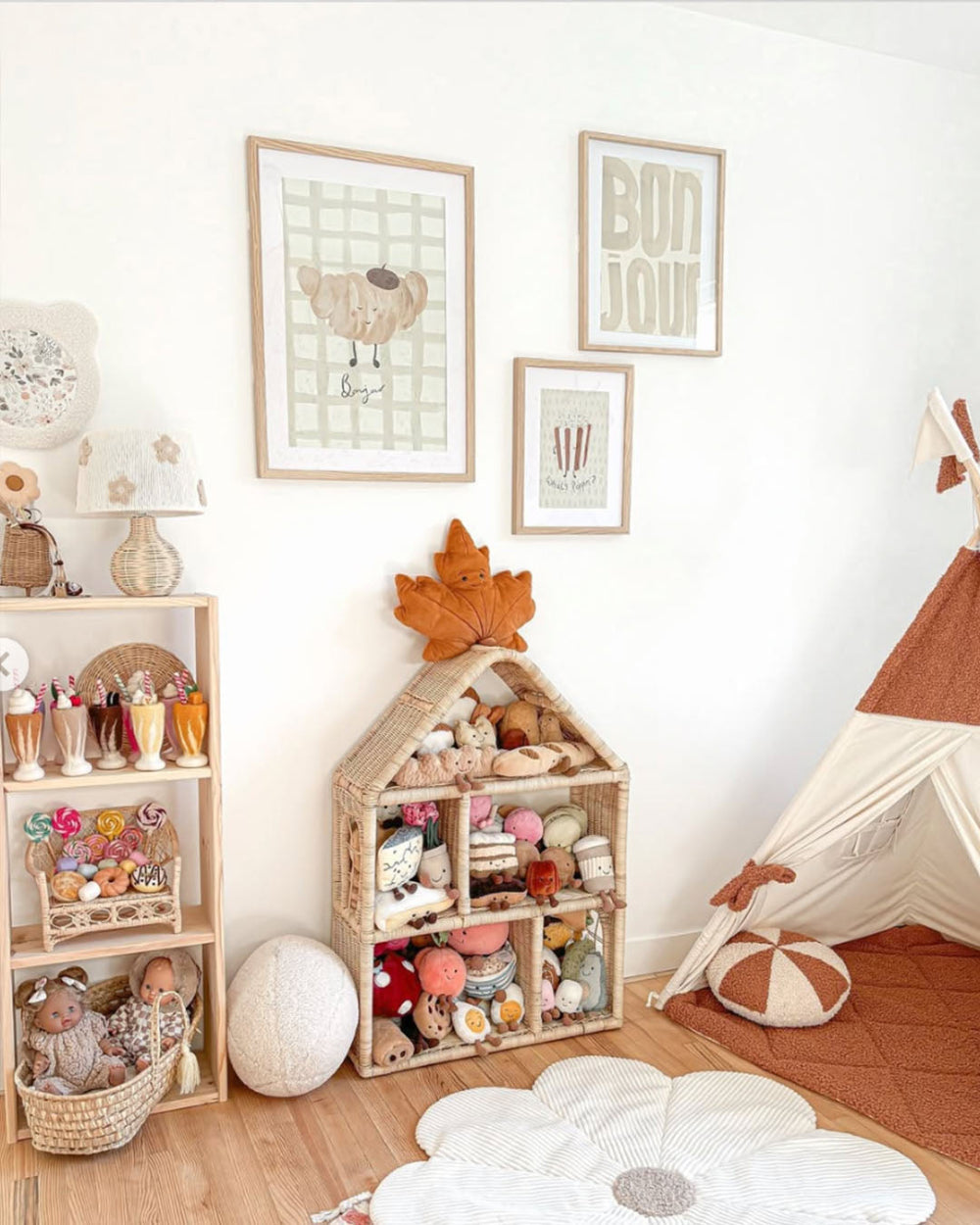 Children's playroom with toys, shelves, and wall art in a cozy setting.