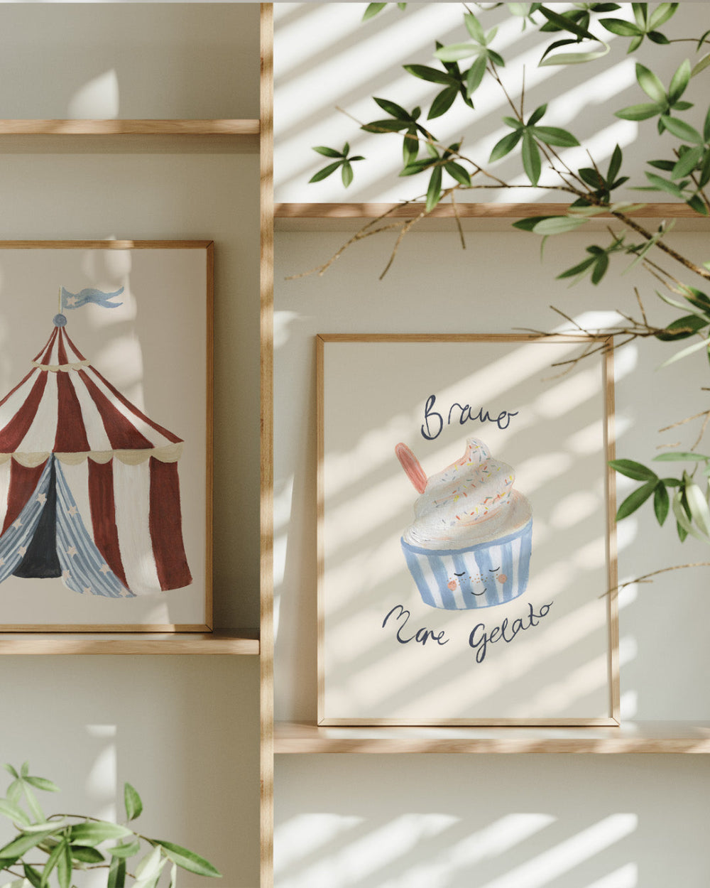 Framed artwork of a striped tent and ice cream pot with 'Bravo more Gelato' text on a shelf.