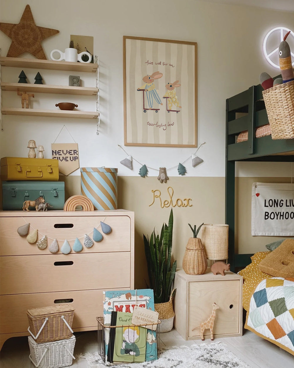 Children's room with wooden dresser, shelves, and decorative items.