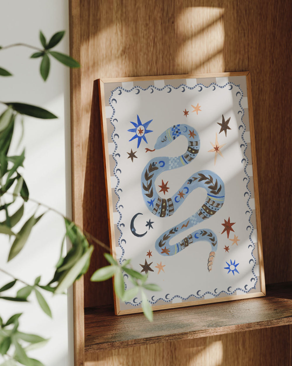 Decorative print with a snake design on a wooden shelf.