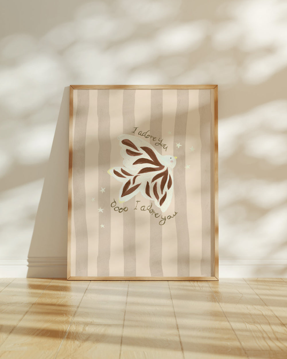 Framed artwork with decorative design and text on a striped wall.