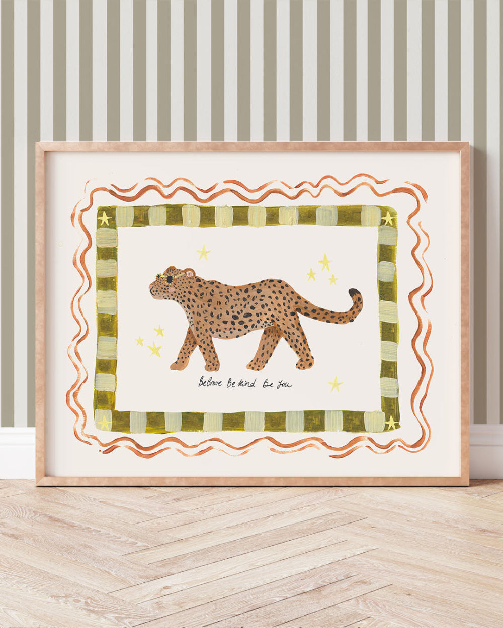 Framed artwork of a leopard on a striped wall