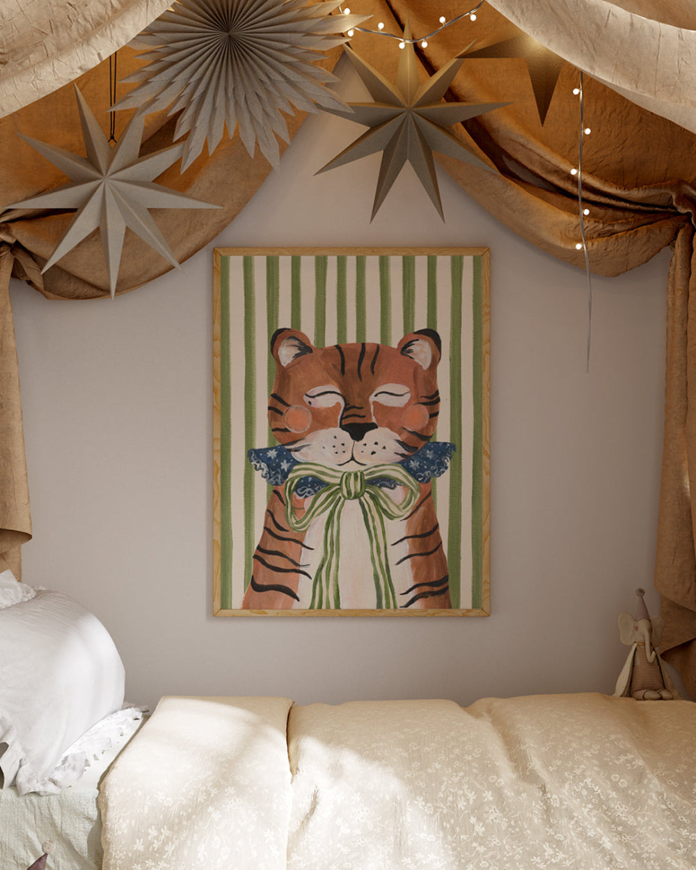 Framed artwork of two tigers holding flowers on a wall with decorative stars and curtains.