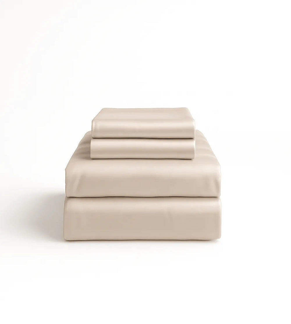 Oatmeal bed sheets set on a white background