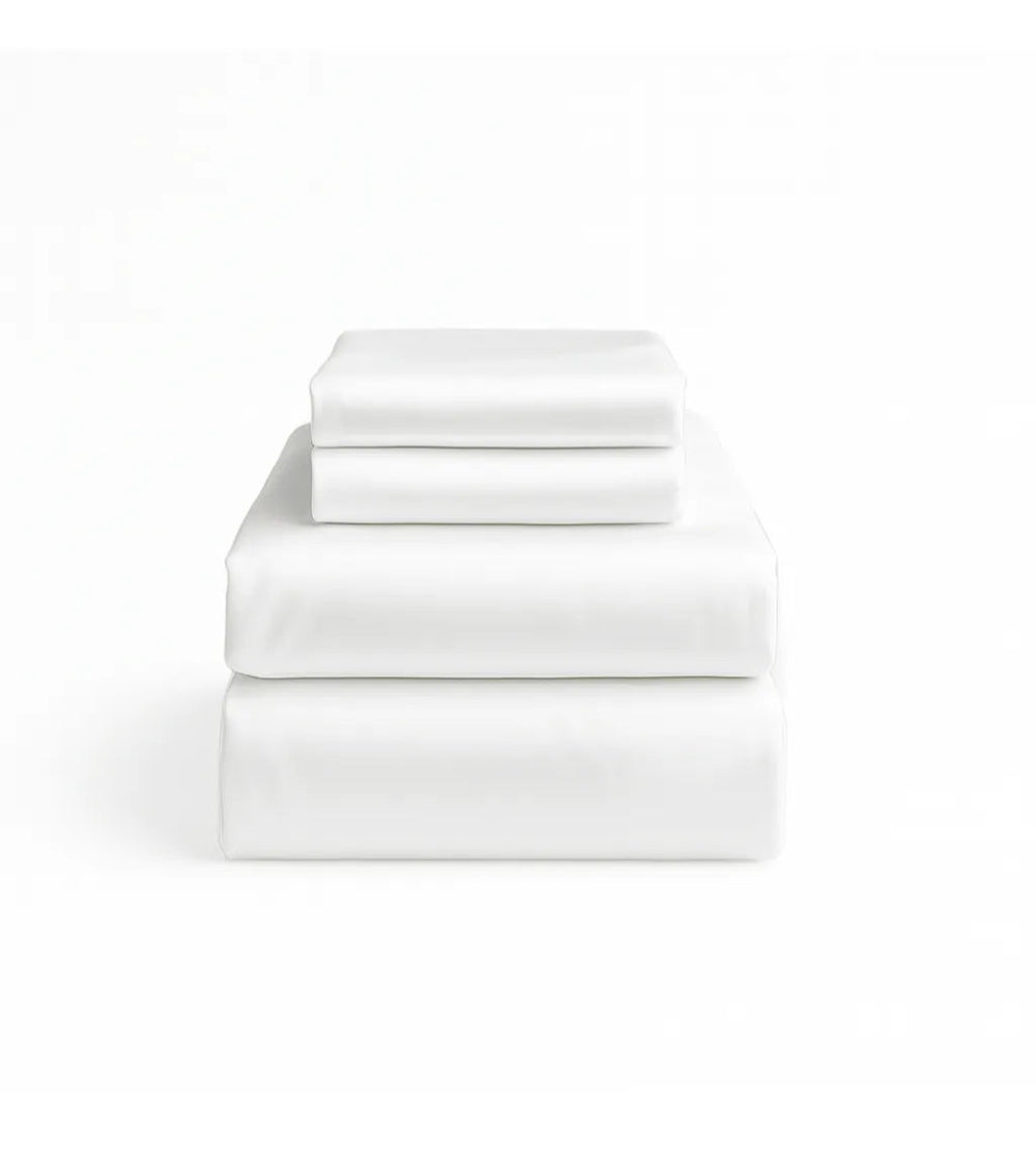 Set of white bed sheets stacked on a white background