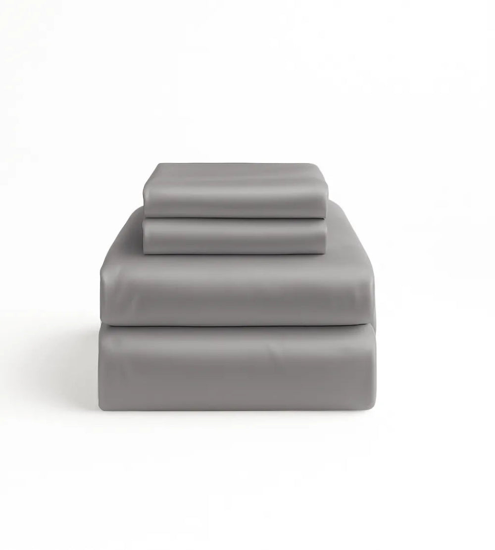 Grey bed sheet set on a white background