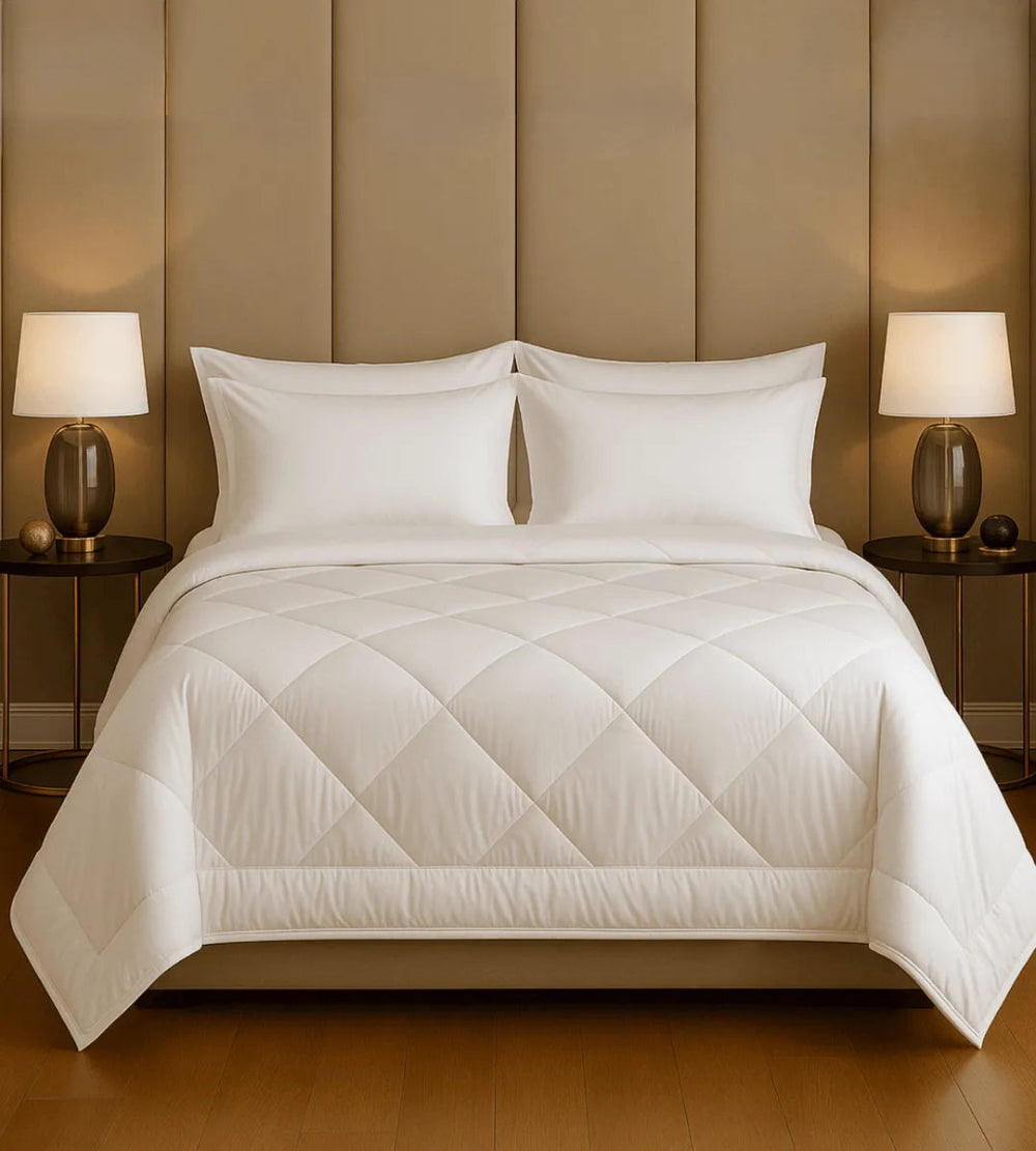 Neatly made bed with white bedding in a bedroom setting