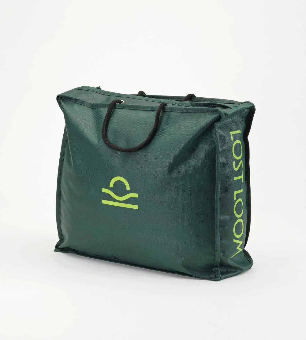 Green bag with a logo and text on a white background