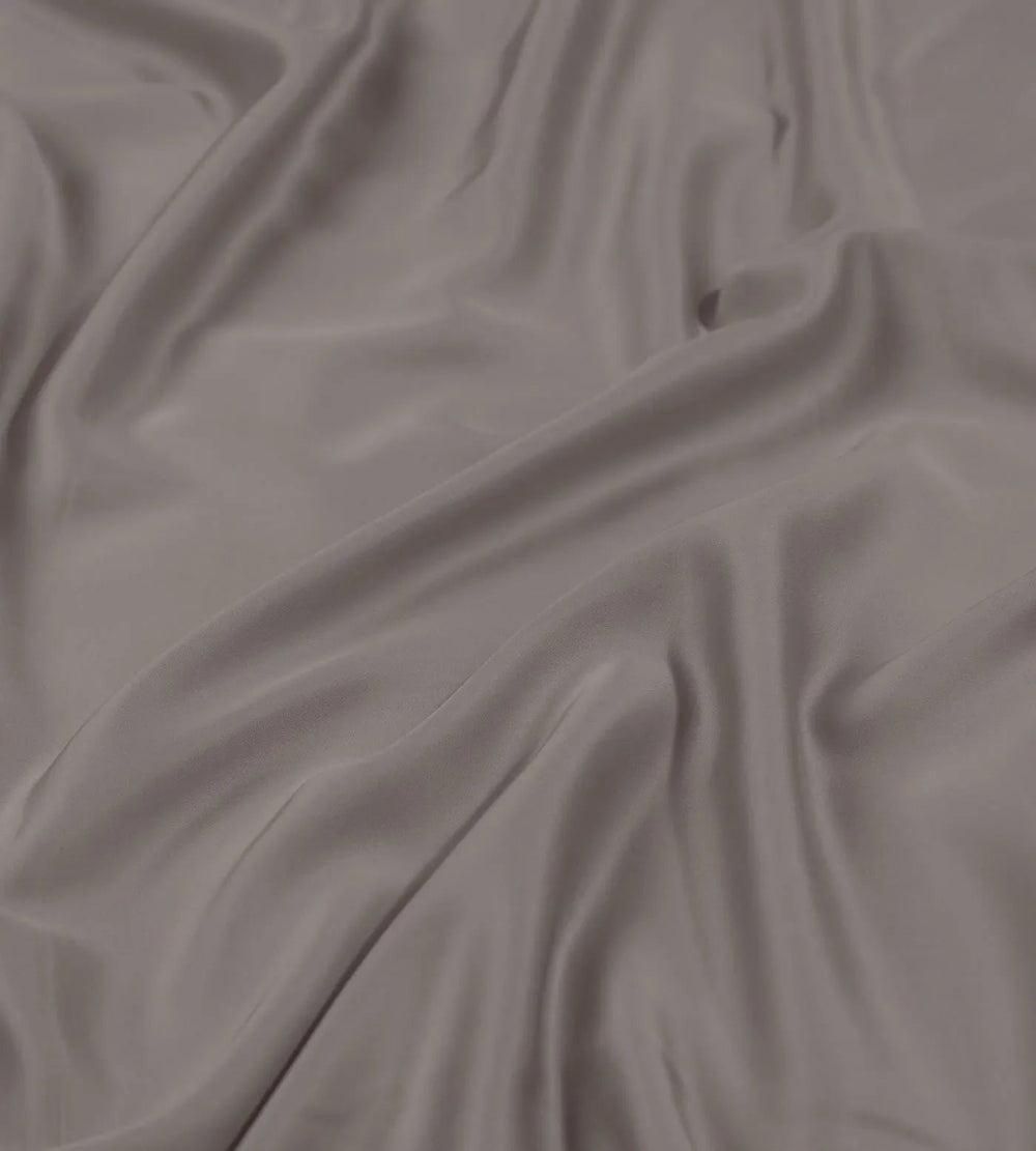 Close-up of gray duvet cover with folds