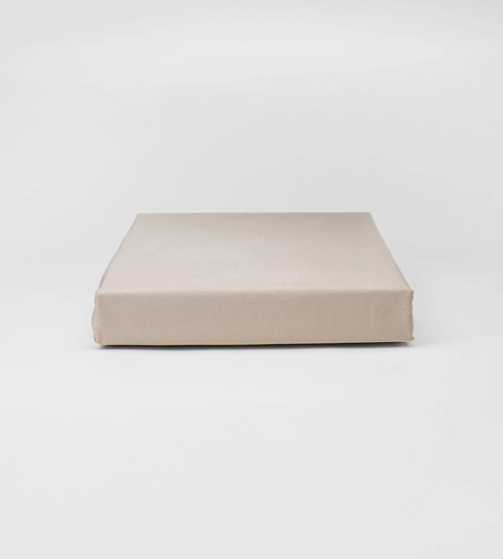 Beige fitted sheet on a white background