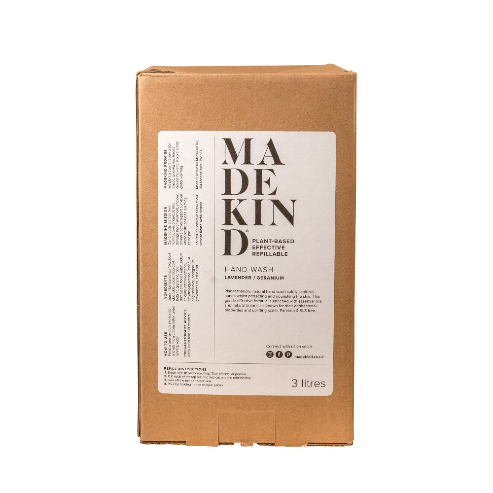 Cardboard box with 'MADE KIND' label for hand wash on a white background