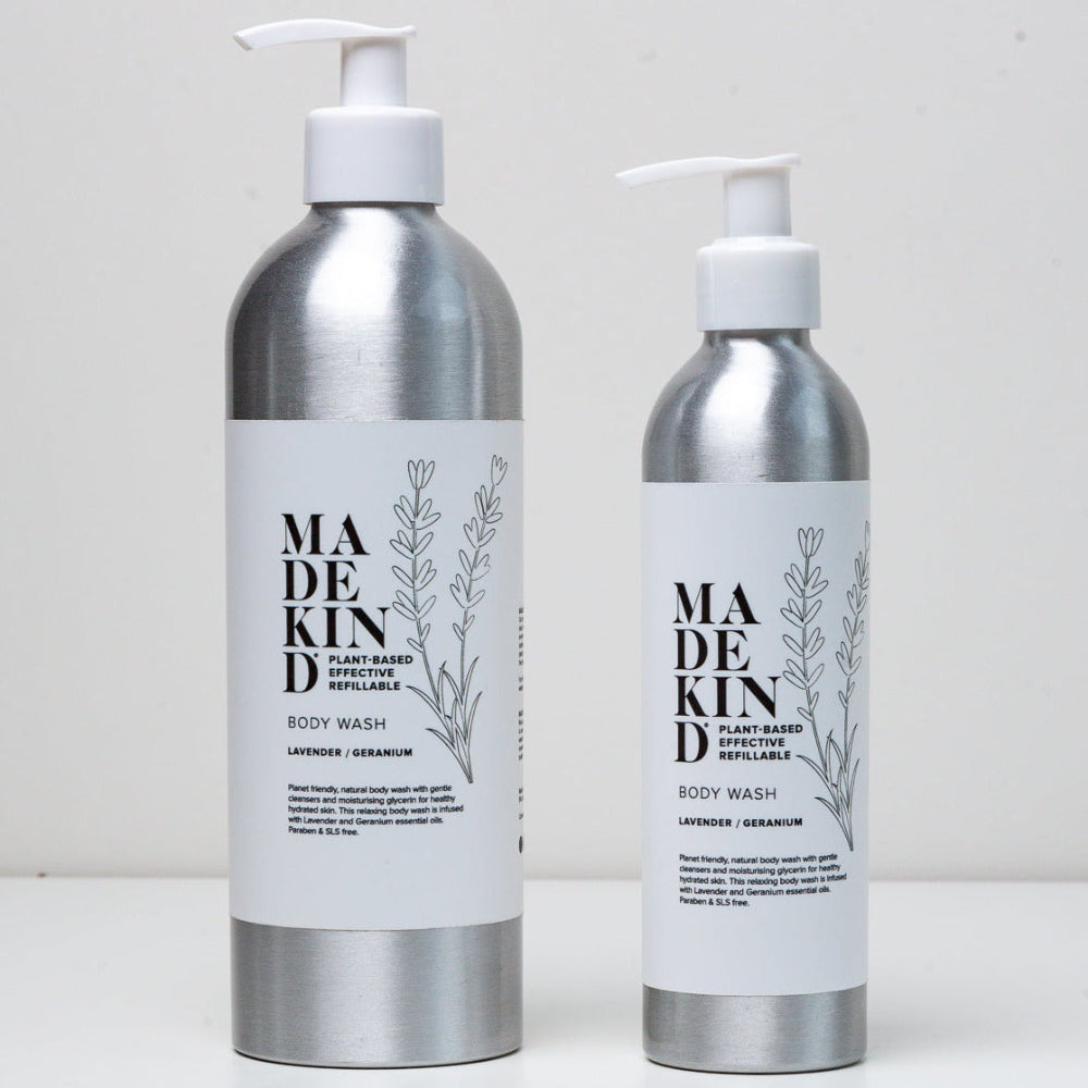 Two bottles of Made kind body wash on a white background. Large and Small bottles.