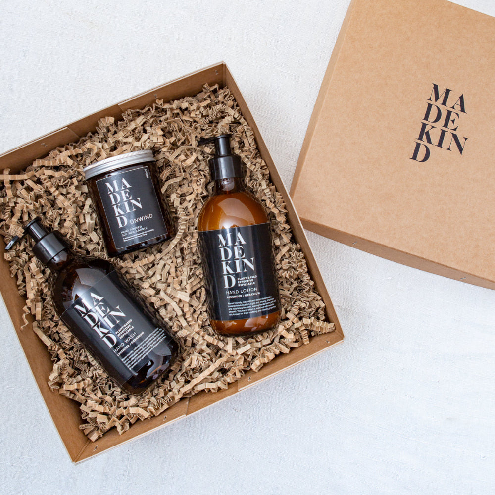 Set of skincare products in a 'MADE KIND' box on a white background
