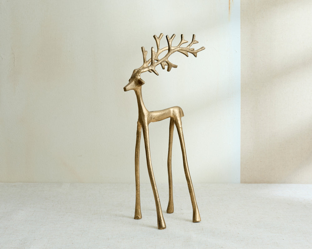 Gold Metal deer figurine on a white background Christmas