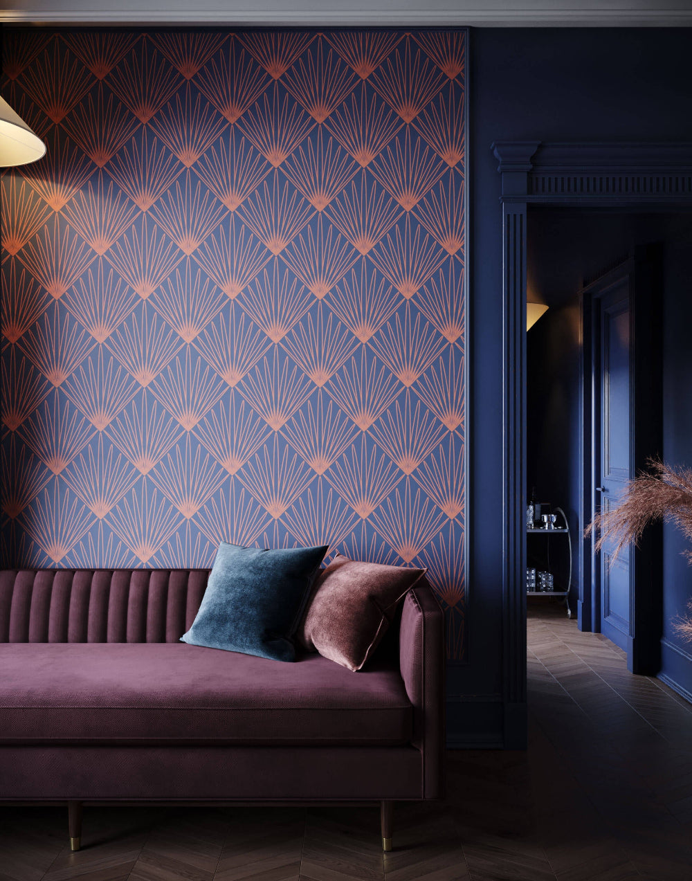 Decorative wall with geometric pattern, purple sofa with pillows, and dark room.