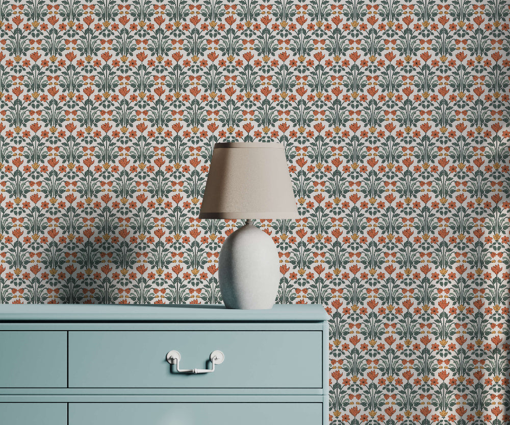 Decorative wallpaper with a floral pattern, a lamp, and a cabinet.