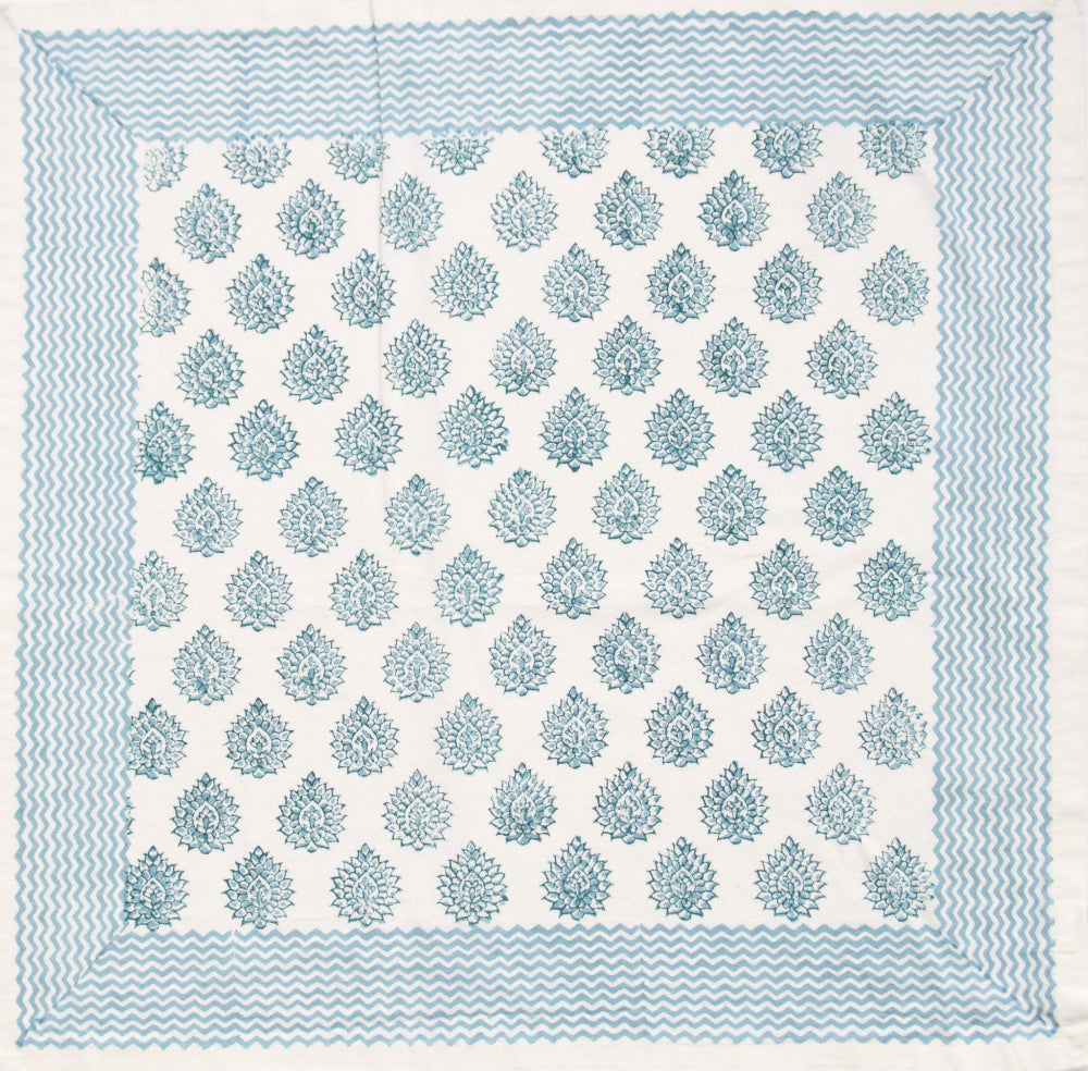Patterned Cotton Napkin with blue and white design on a blue background