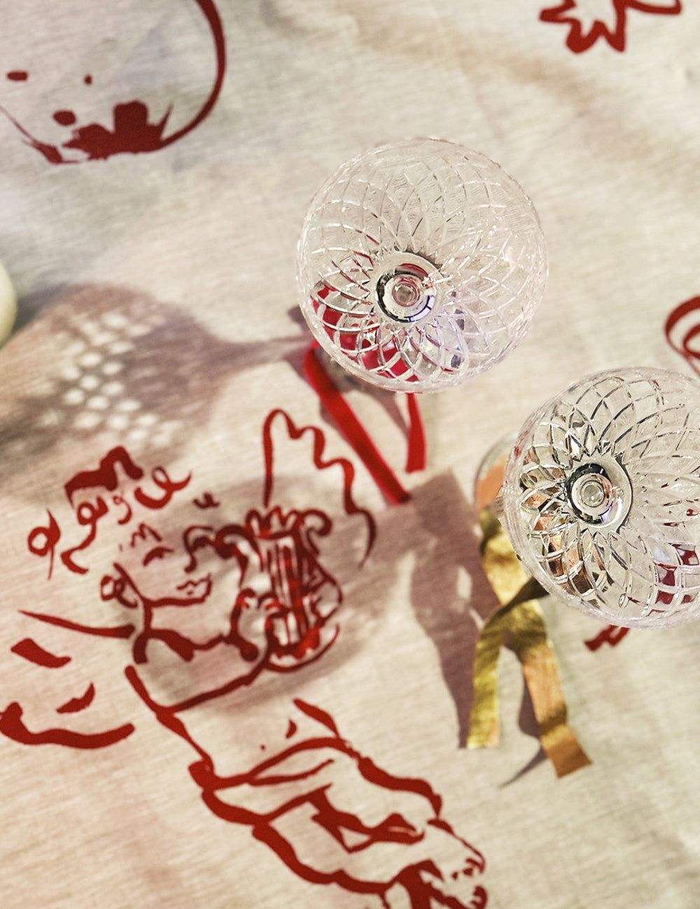 Linen Tablecloth Olivia Sewell Reindeers and Cherubs on a textured surface with red designs