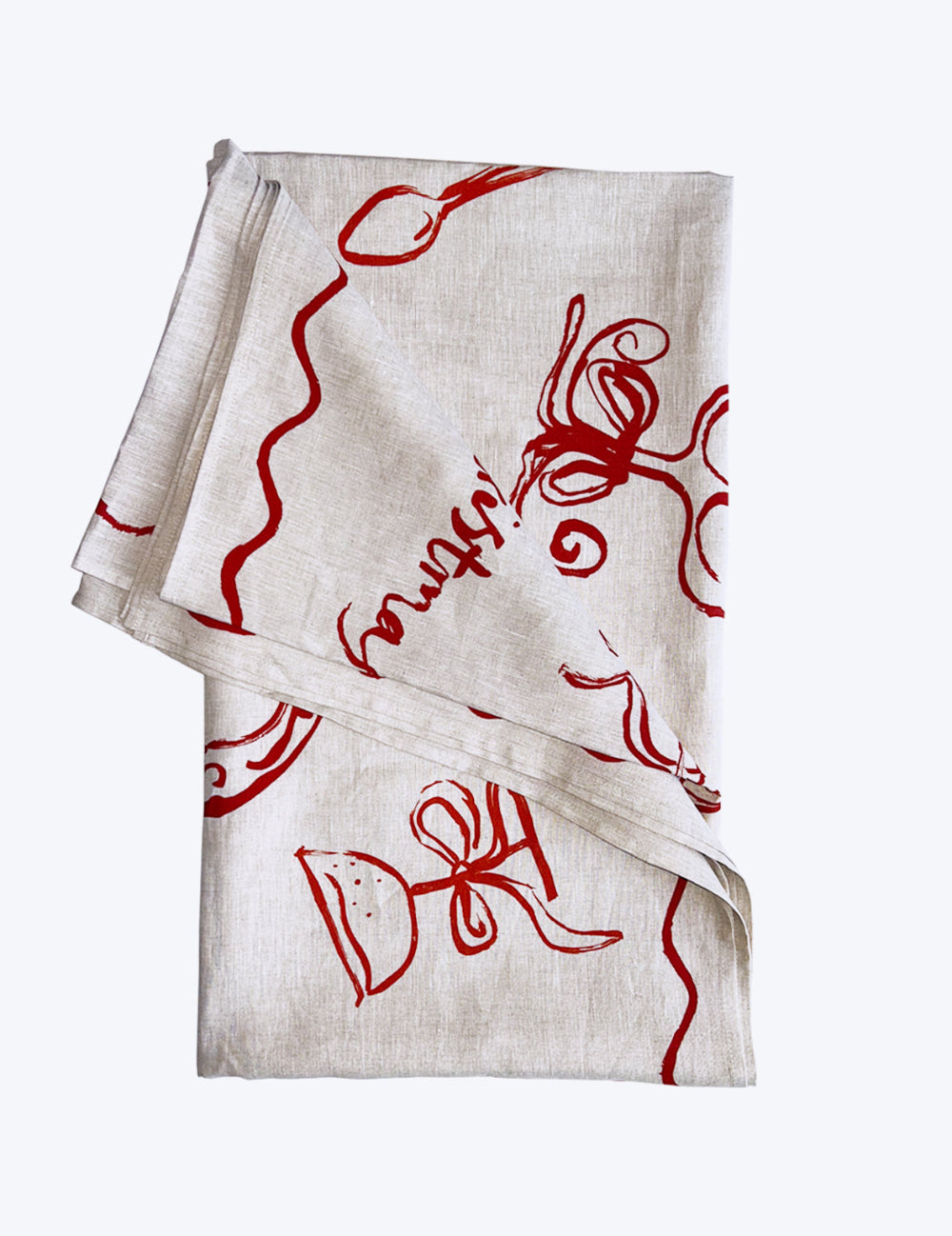 Folded linen tablecloth with christmas themed designs on a white background