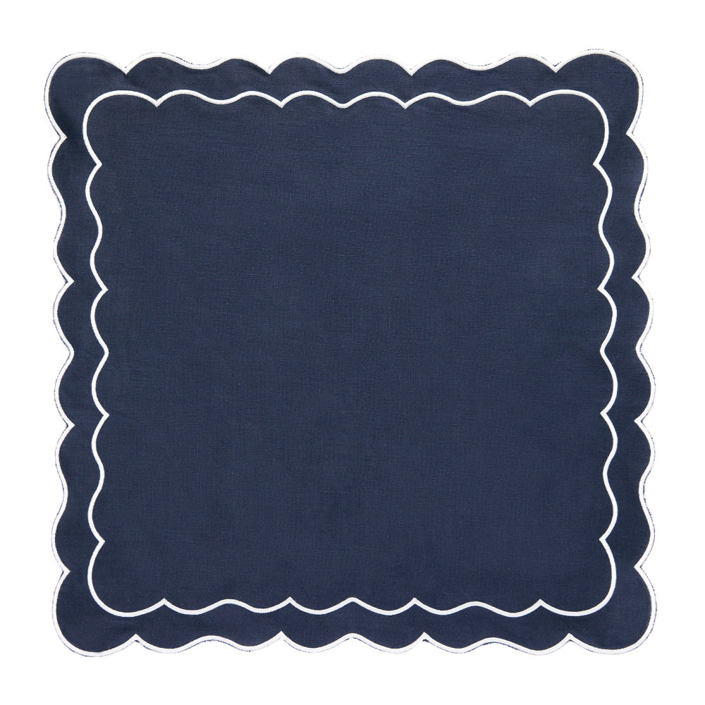 Navy blue placemat with scalloped edge on a white background