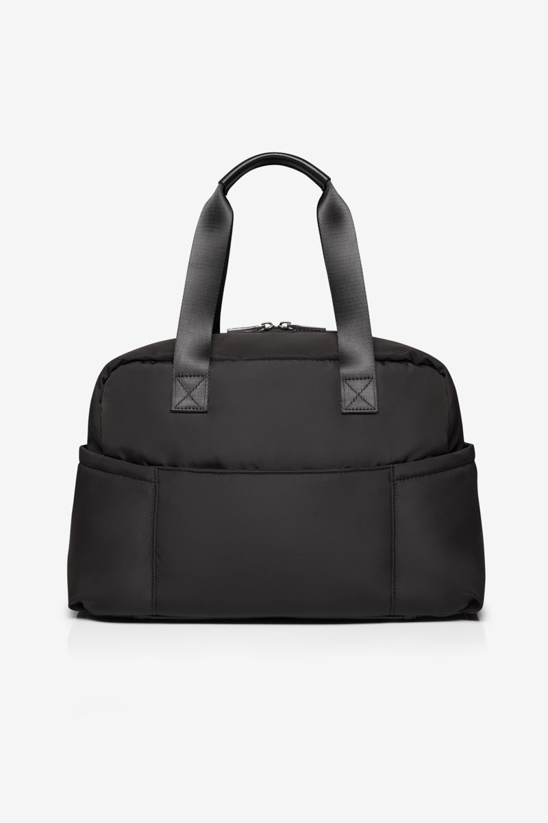 Black handbag with straps on a white background