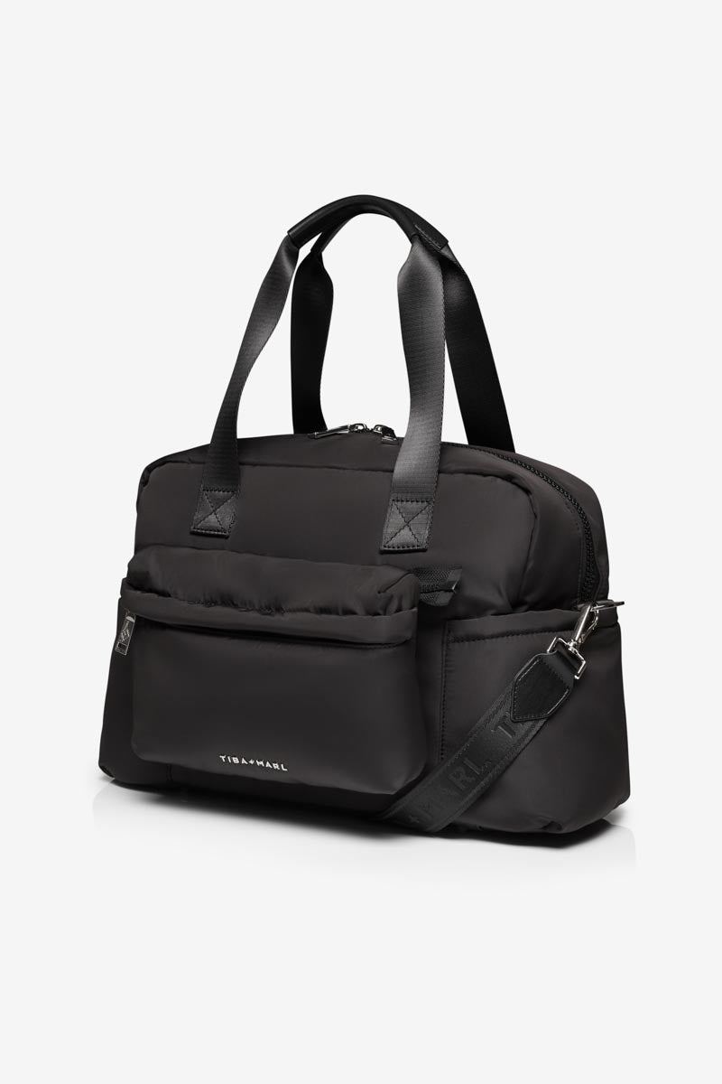Black duffel bag with shoulder strap on a white background