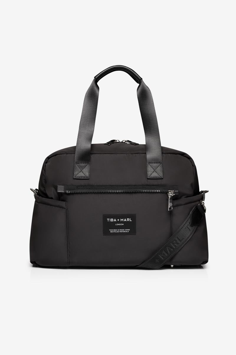 Black duffel bag with a visible brand label on a white background