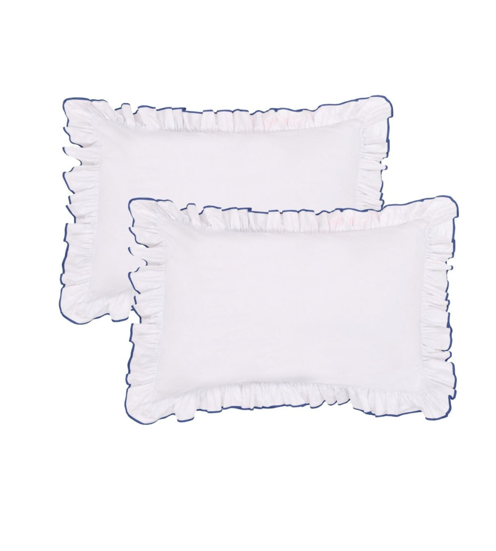 Provence Teal Two white pillows with ruffled edges on a white background