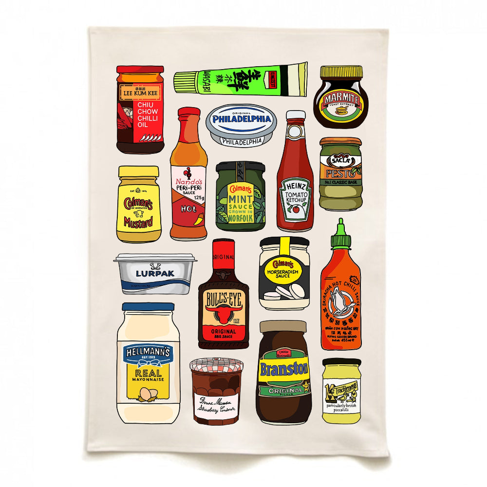 Tea towel with illustrations of various condiments on a white background