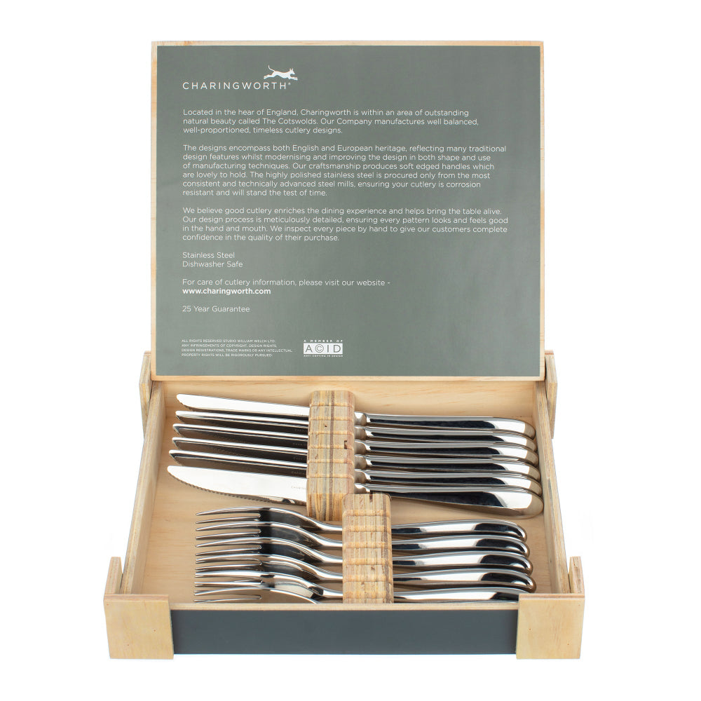 Set of silver cutlery in a wooden box with Charingworth branding.