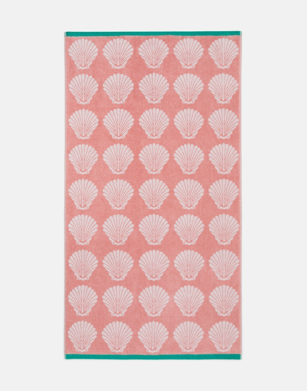 Towel with white shell pattern on a pink background
