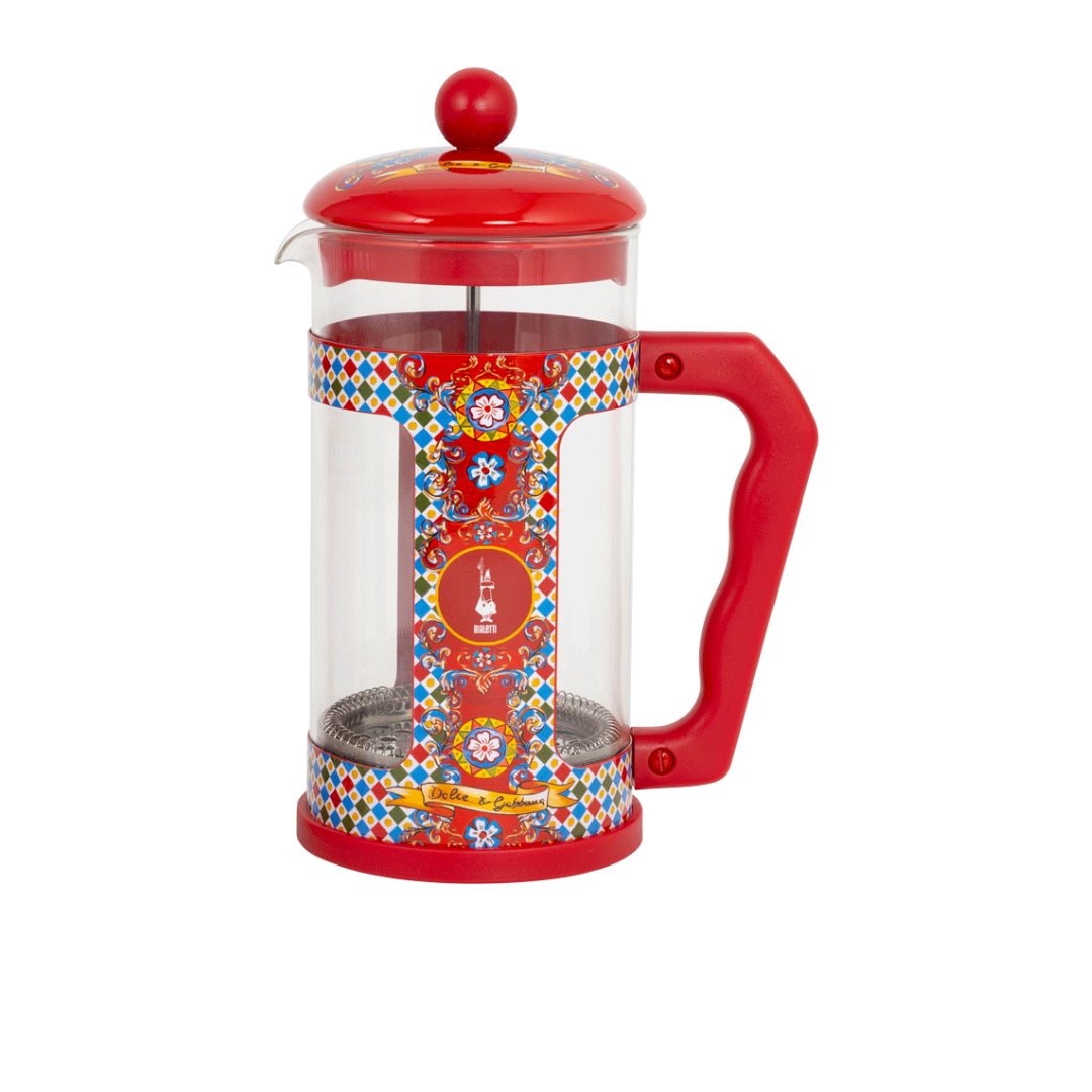Red French press coffee maker with colorful design on a white background