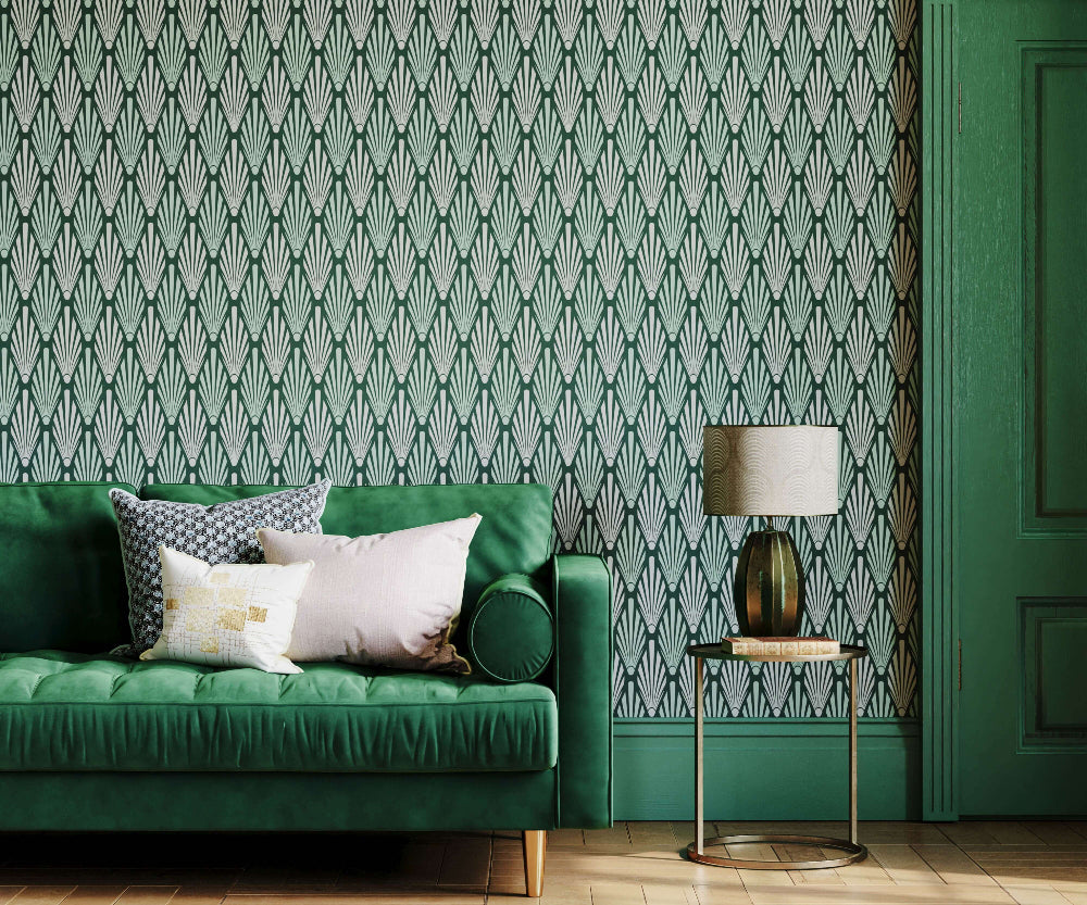 Green sofa with Bold art deco patterned wallpaper and side table in a room
