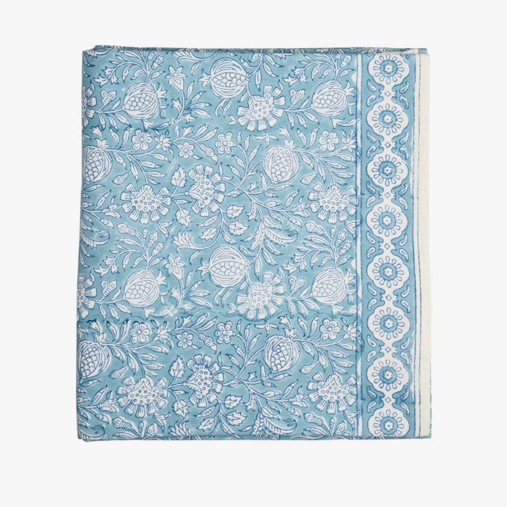 Tablecloth Folded with blue floral and geometric pattern on a white background