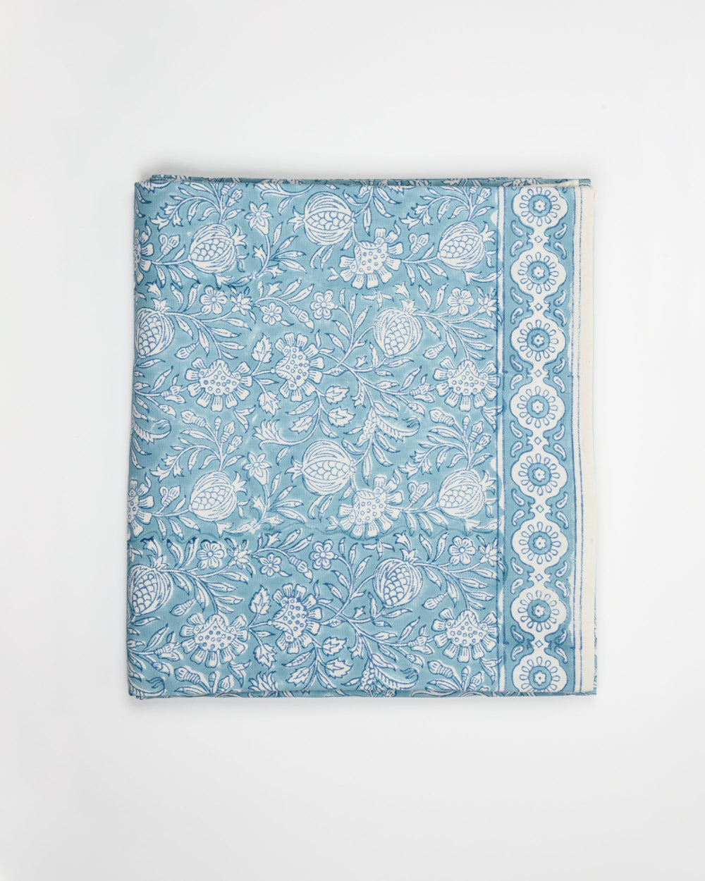 Blue Tablecloth with white floral and geometric patterns on a white background