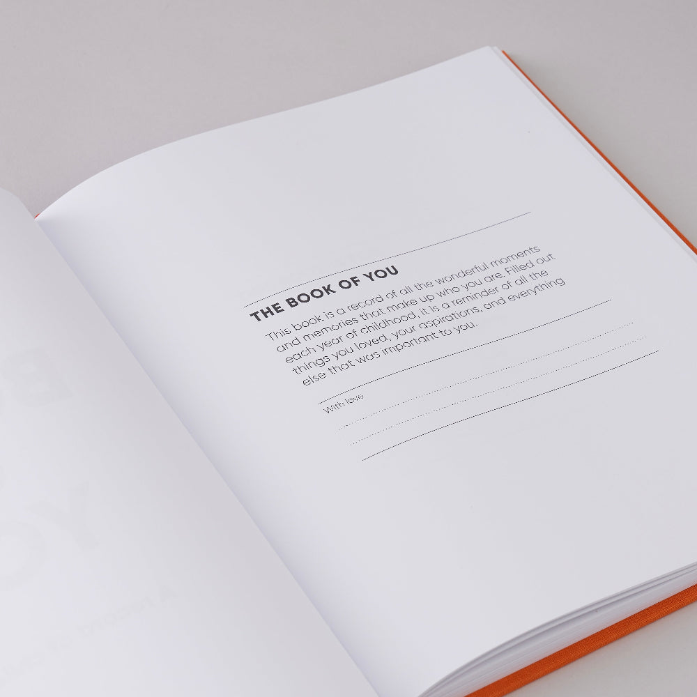 Open book of The Book of you a record of your childhood opening page on a white background