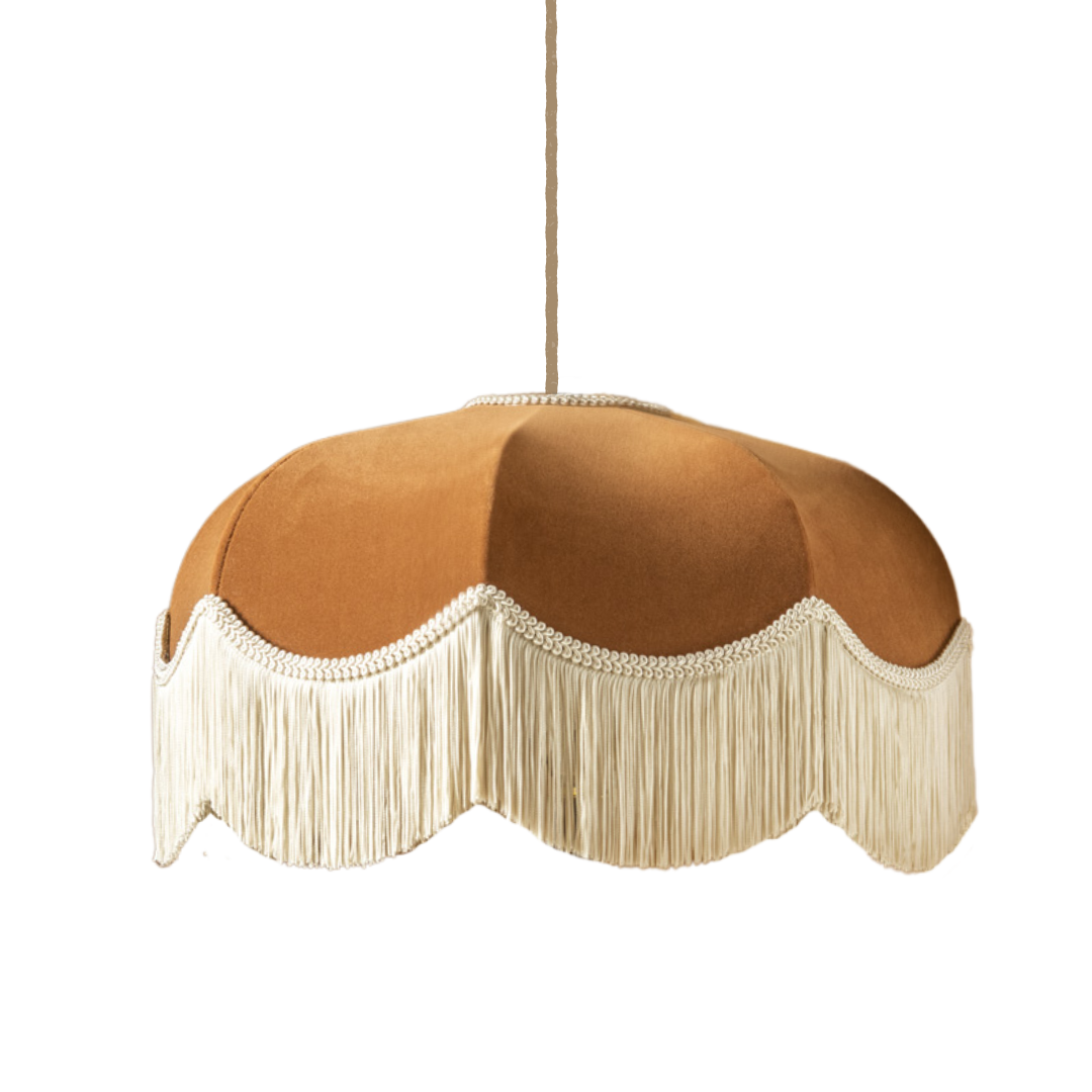 Decorative pendant light with brown shade and white fringe on a white background
