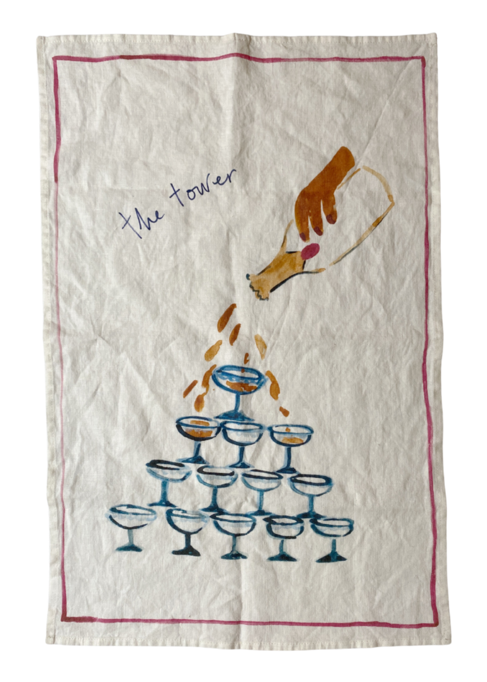 Tea towel with a design of a hand pouring champagne into glasses in a tower formation.