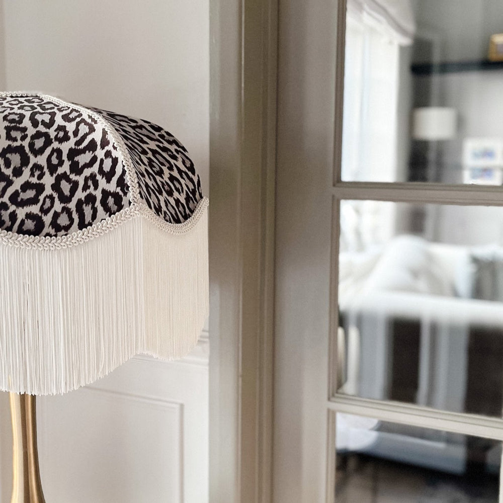 Decorative lamp with leopard print shade in a room setting