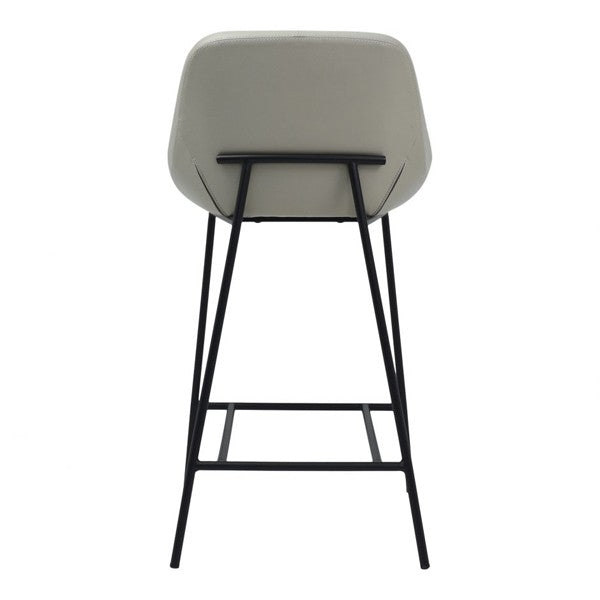Bar stool with grey cushioned seat and black metal legs on a white background