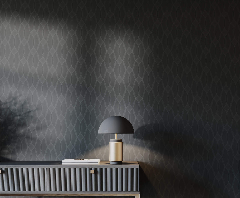 Modern lamp on a console table against  dark patterned wallpaper