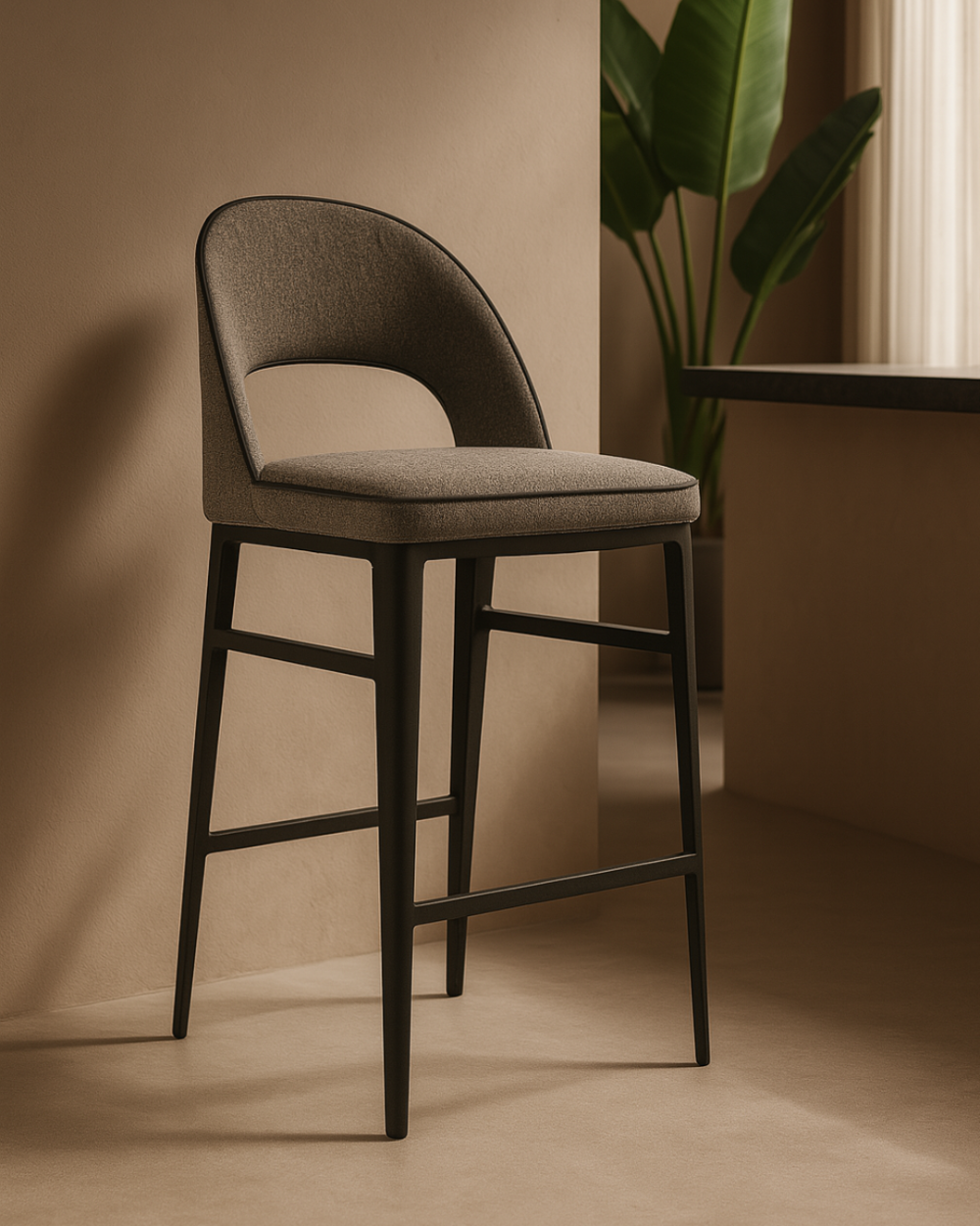 Tommy Franks Grey Bar Stool cushioned bar stool against a beige wall with a plant in the background