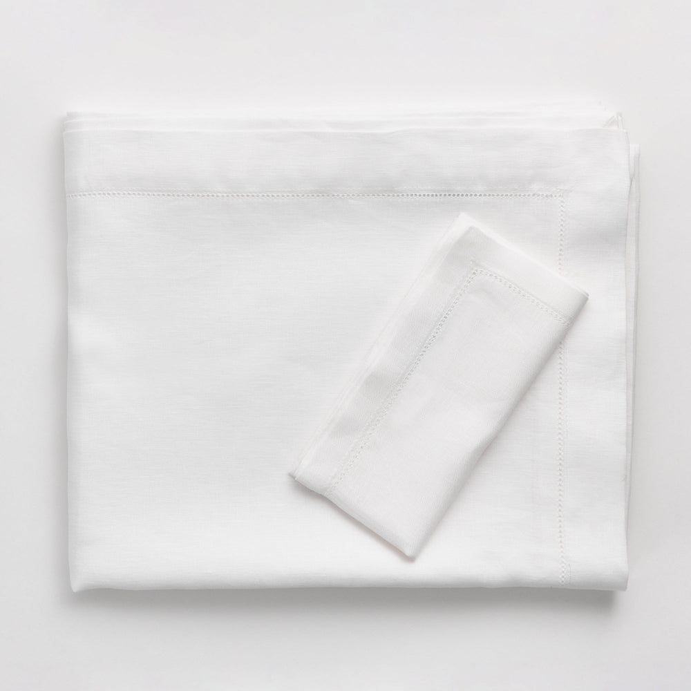 White folded tablecloth on a white background