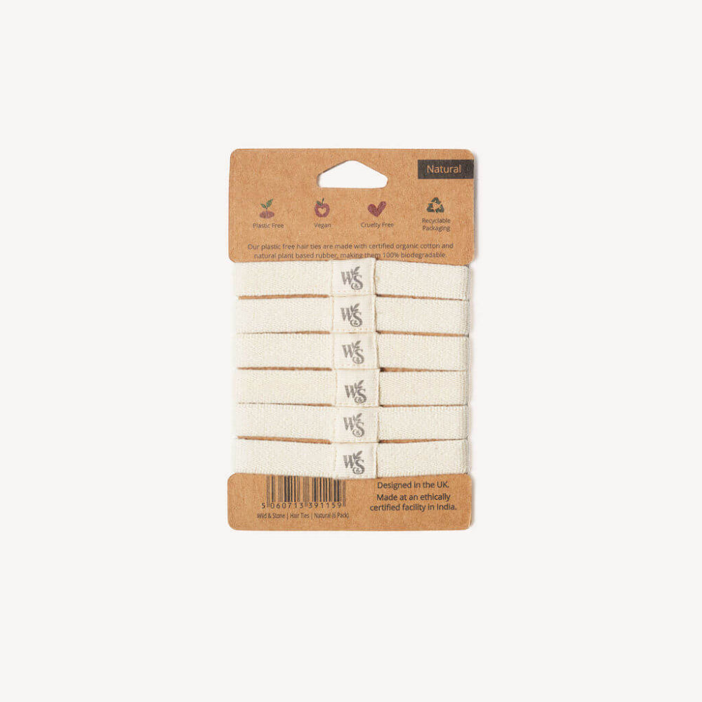 Pack of natural hair ties by Wild & Stone with cardboard packaging on a white background