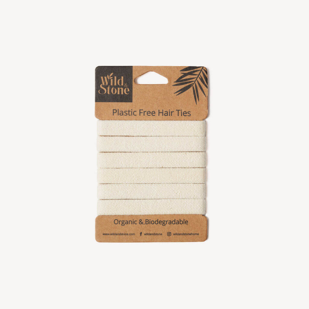 Pack of organic biodegradable hair ties with Wild & Stone branding on a white background