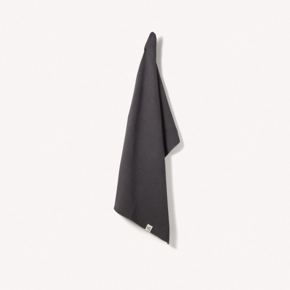 Slate Grey textured organic hand towel hanging on a white background