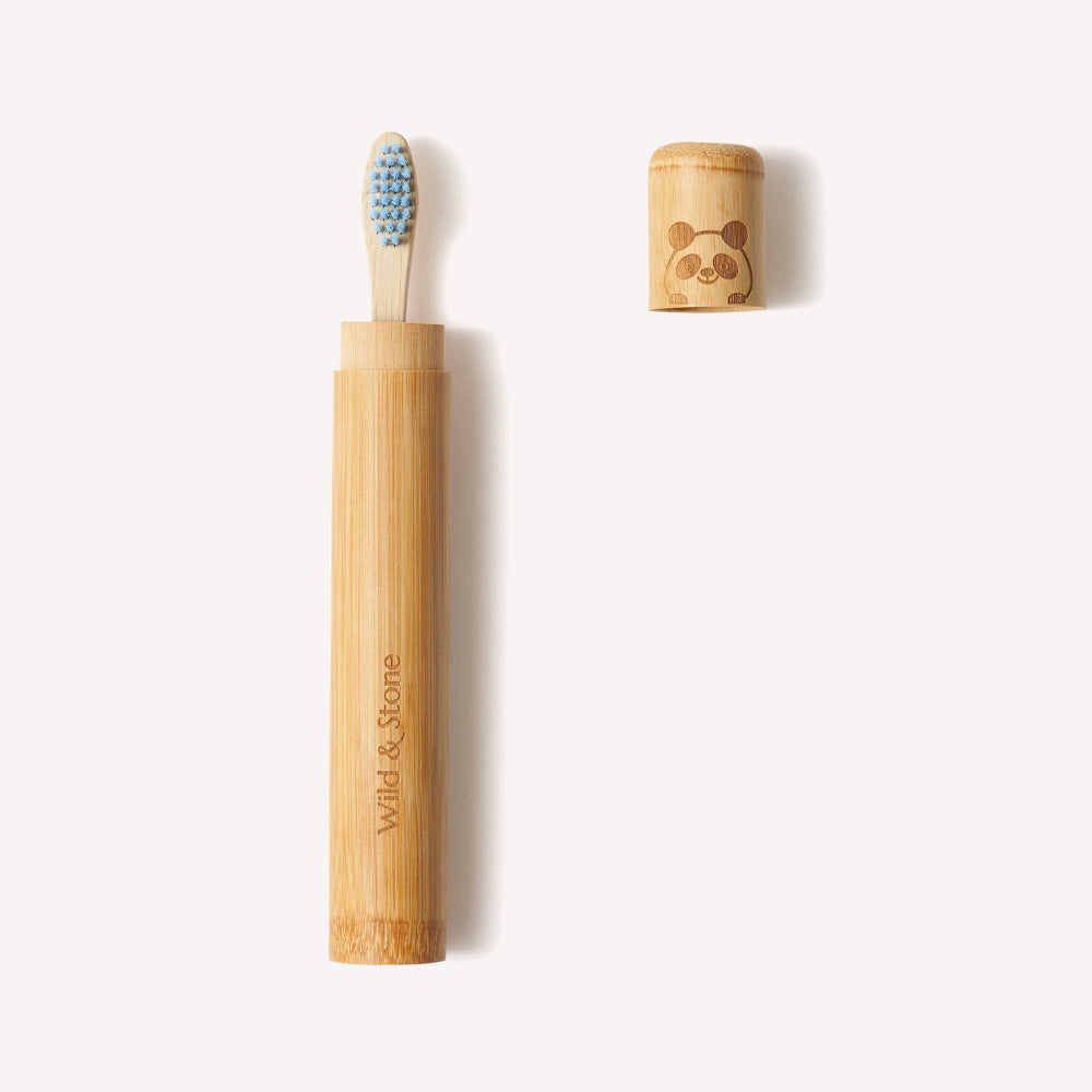 Bamboo toothbrush with travel case on a white background